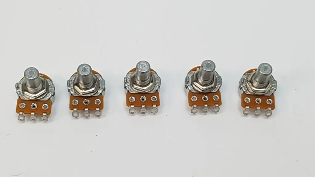 Five Alpha B50K potentiometers with hex nuts, round shafts and solder lugs