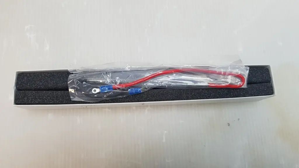 Amglo AQH-4635 laser lamp in a clear bag on foam inside a white box