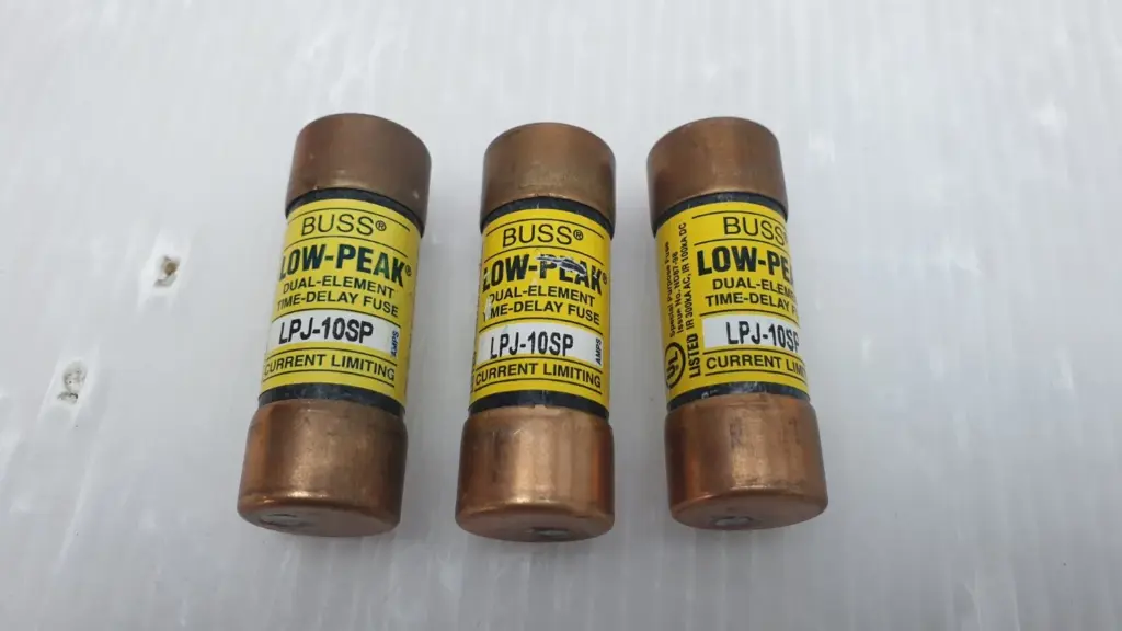 Three Bussmann Low-Peak LPJ-10SP 10 A Class J time-delay fuses side by side