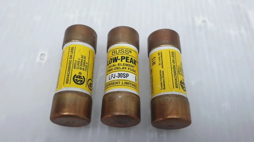 Three Bussmann Low-Peak LPJ-30SP 30 A Class J fuses lined up