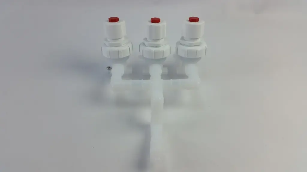 Set of three Fluoroware 201-39-01 diaphragm valves with red caps on a plastic manifold