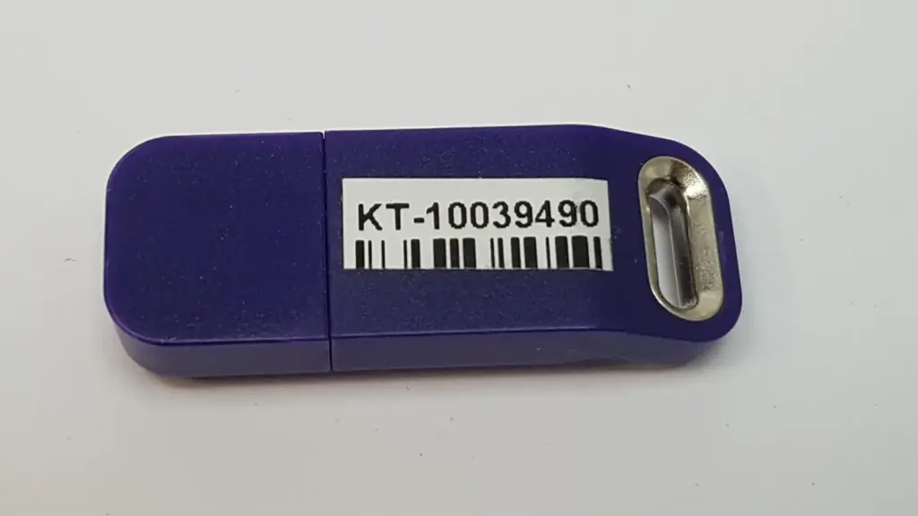 Lumenis KT-10039490 upgrade HASP, purple USB key with part number barcode label