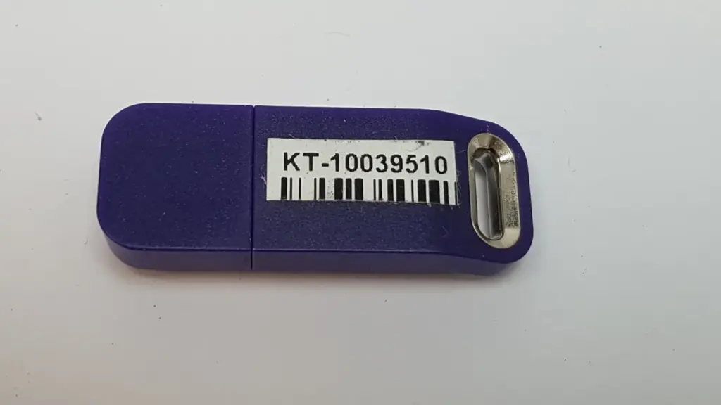 Lumenis KT-10039510 upgrade HASP, purple USB key with part number barcode