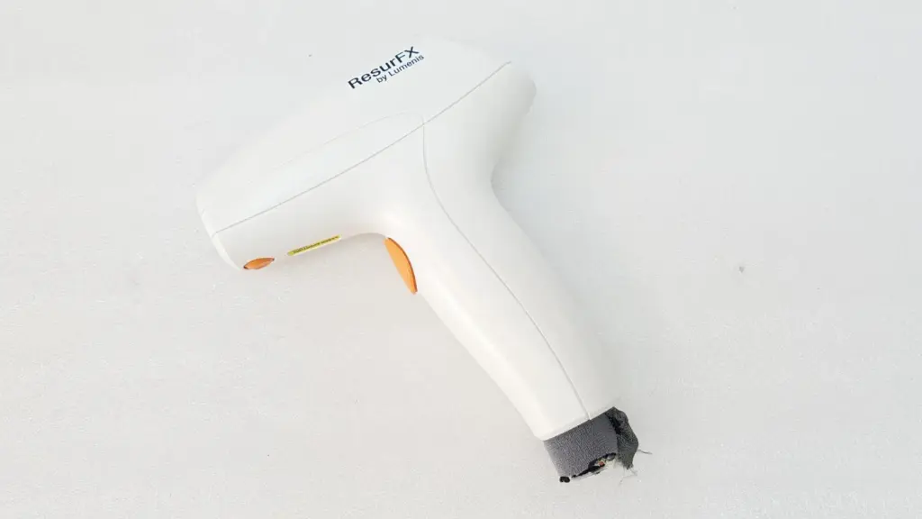 Lumenis M22 ResurFX fractional laser handpiece with orange buttons and cut cable