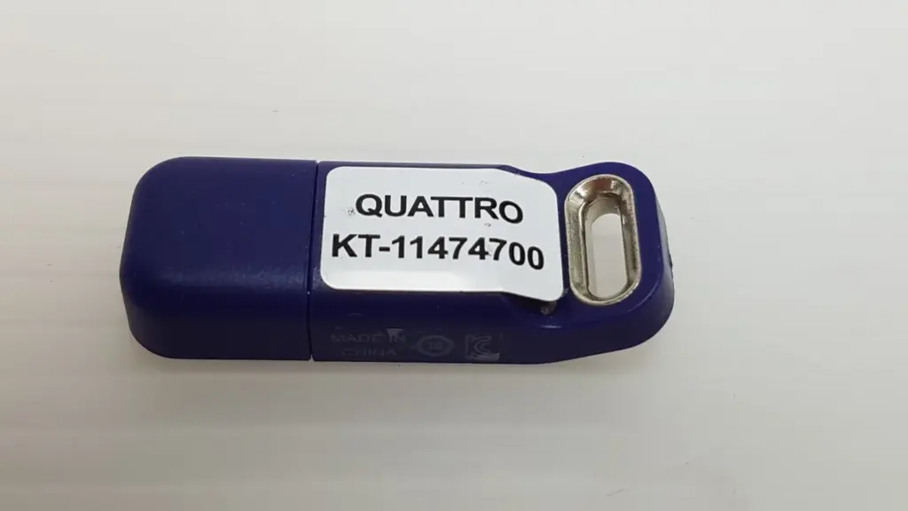 Lumenis Quattro KT-11474700 HASP USB key, purple housing with label and eyelet