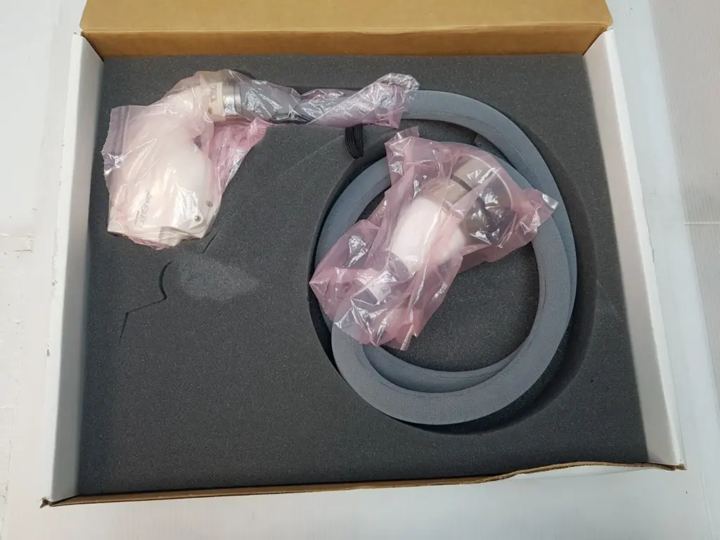 Lumenis SA-10030610GR LightSheer handpiece and cable in plastic bags in a foam-lined box