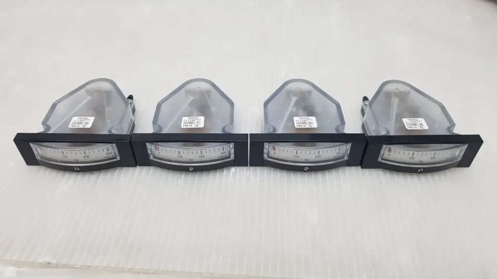 Four Manostar FR51A differential pressure gauges in a row, front scales 0–300 Pa