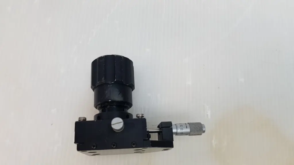 Melles Griot micrometer translation stage with black knurled cylindrical mount, side view