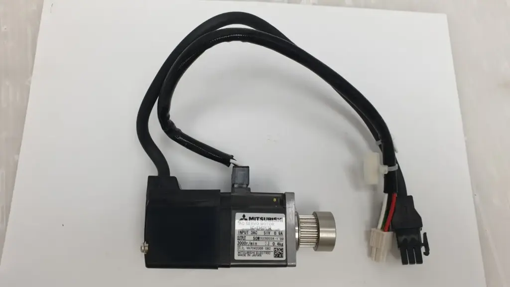 Mitsubishi HC-KFS053K AC servo motor with its power and encoder leads and a timing-belt pulley