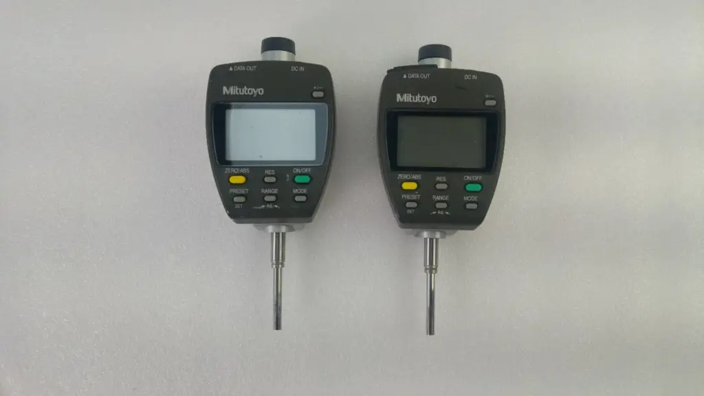 Two Mitutoyo 543-551-1 ID-F125 ABSOLUTE Digimatic indicators, front view with displays and keypads