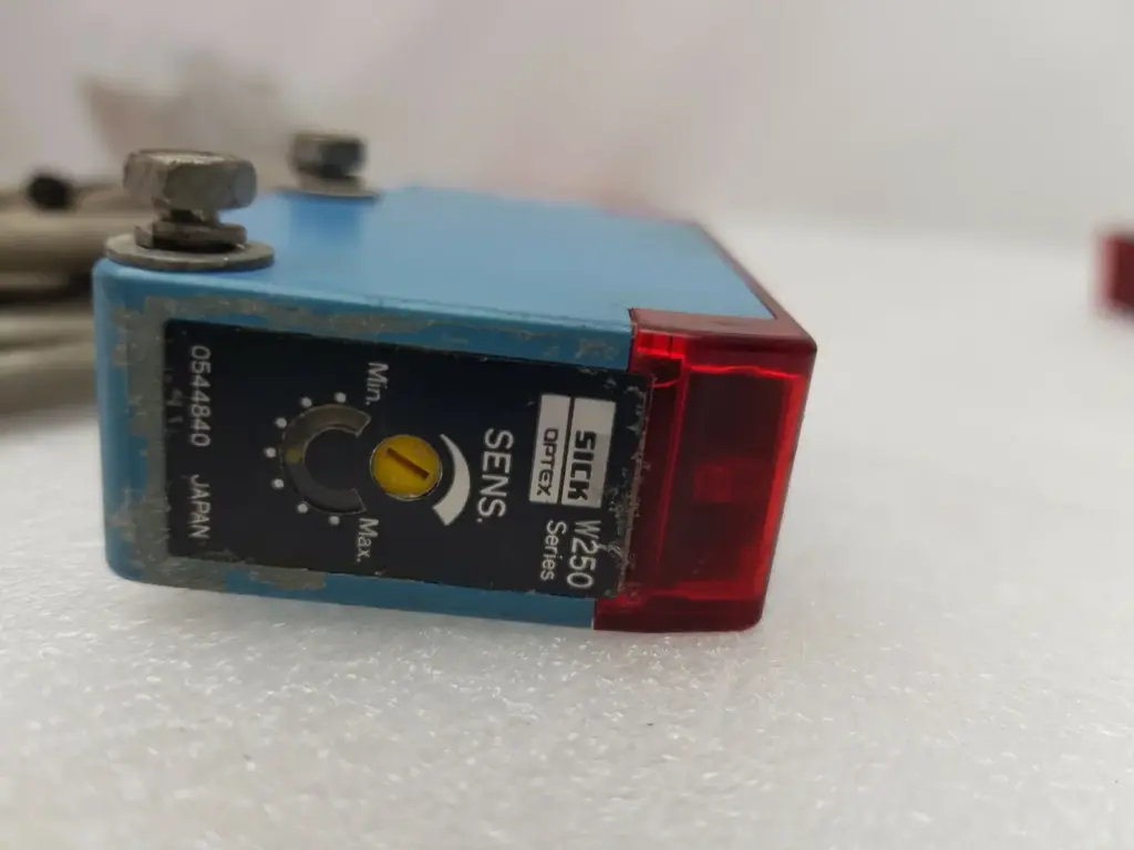 SICK WT250-S162 W250 series sensor showing the SENS. Min–Max adjustment potentiometer and red front optic