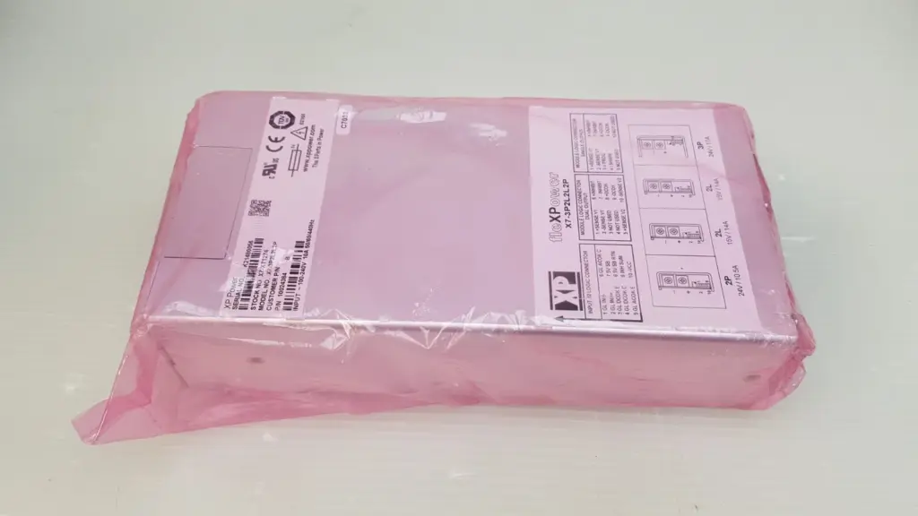 XP Power X7-3P2L2L2P fleXPower power supply in a pink anti-static bag