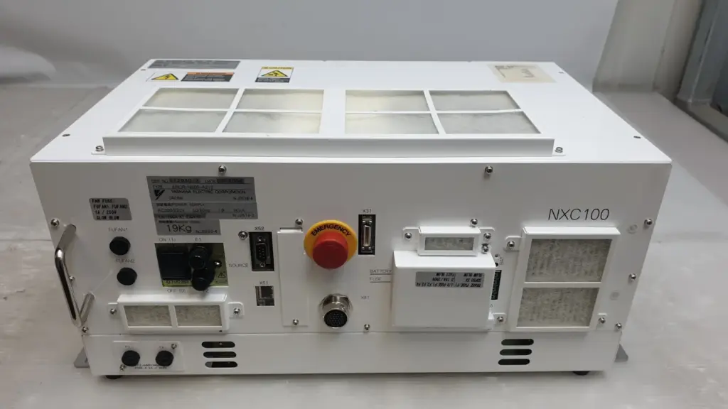 Yaskawa NXC100 robot controller ERCR-NS00-A210, front view with emergency stop button and cooling filters