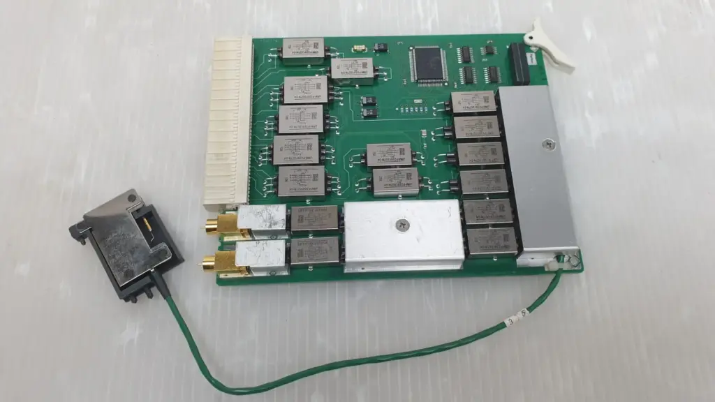 Agilent E3121-66511 pin board PCB with metal-can modules, two gold coax jacks and green lead to black connector