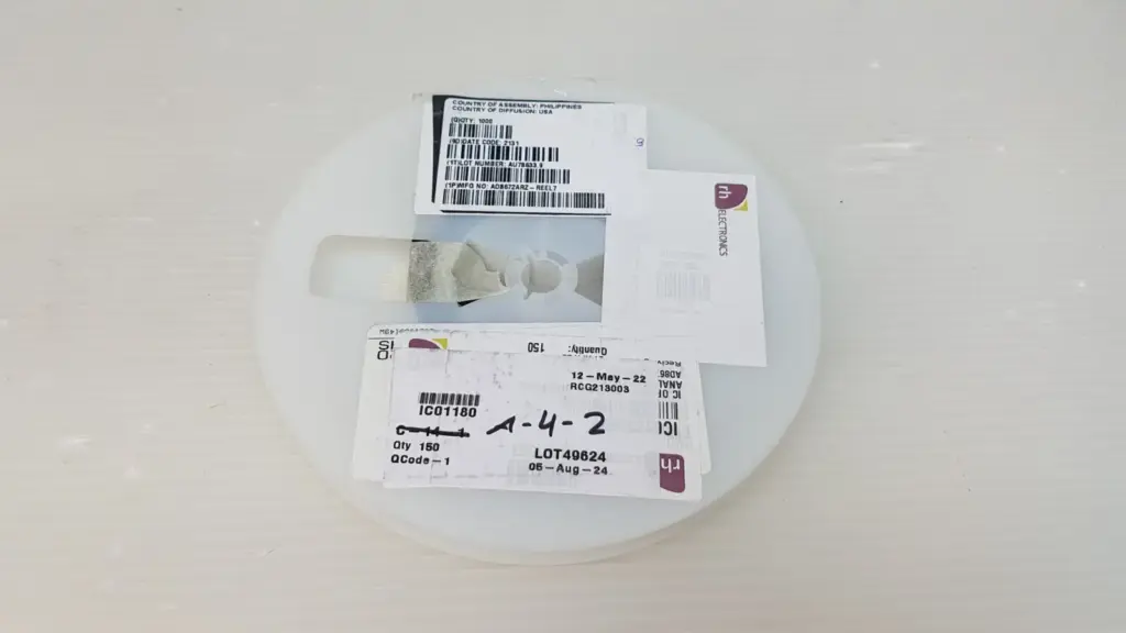 Cut reel of Analog Devices AD8672ARZ-REEL7 with manufacturer and distributor labels, Qty 150