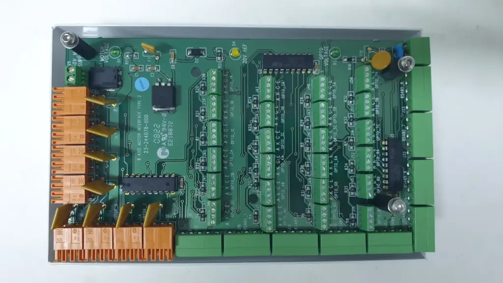 23-244078-000 8 Axis Motor Interface Type 2 board in open white enclosure, orange motor and green opto connectors