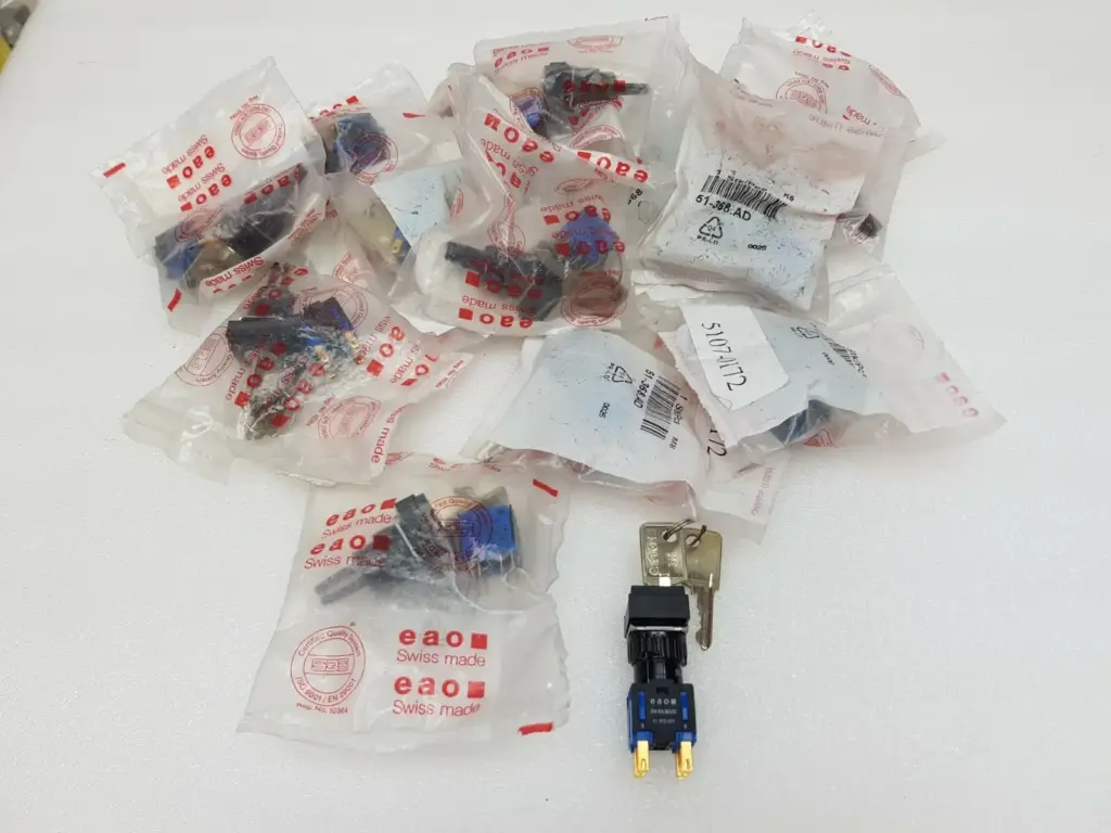 Lot of EAO 51-368.AD keylock switches in Swiss made bags, one switch unpacked with two keys