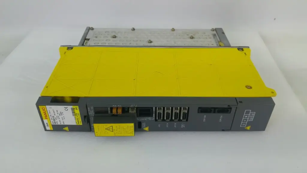FANUC A06B-6096-H104 servo amplifier module with yellow cover, front connectors and heatsink