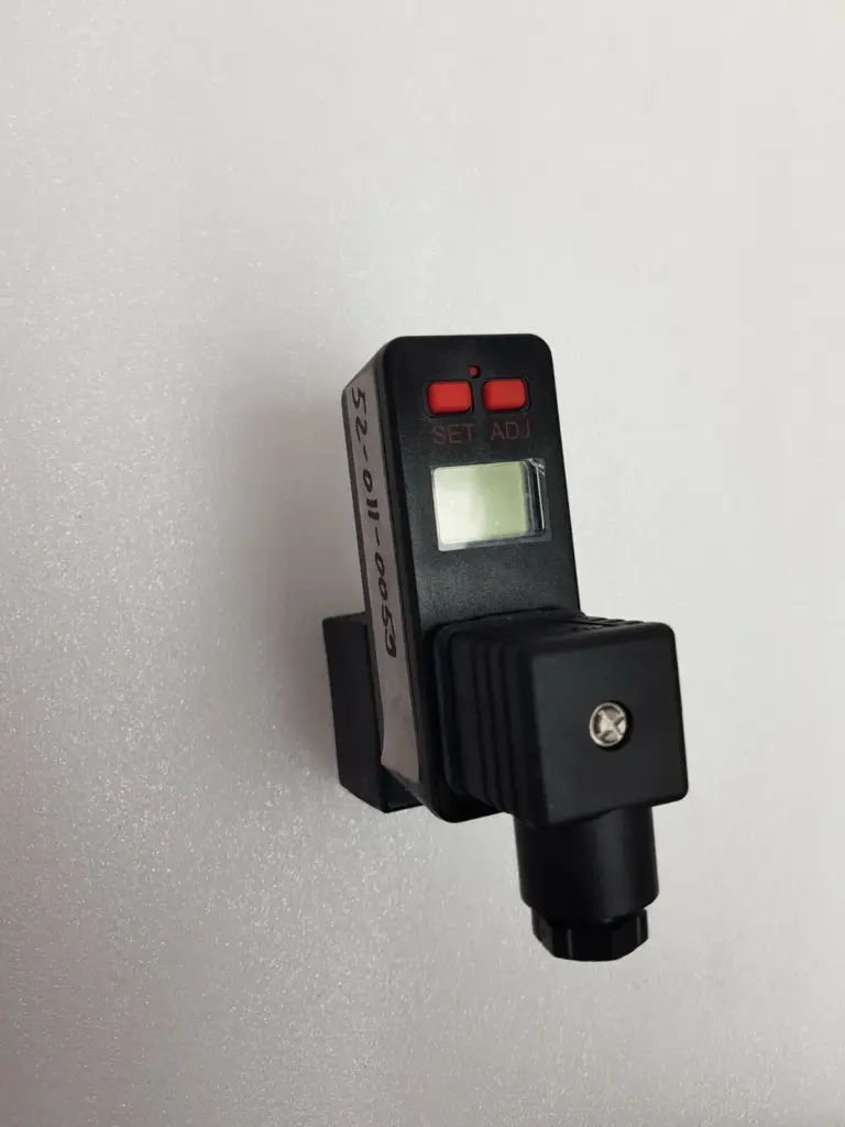 Digital timer with LCD and SET/ADJ buttons on a GEM-SOL coil with DIN connector