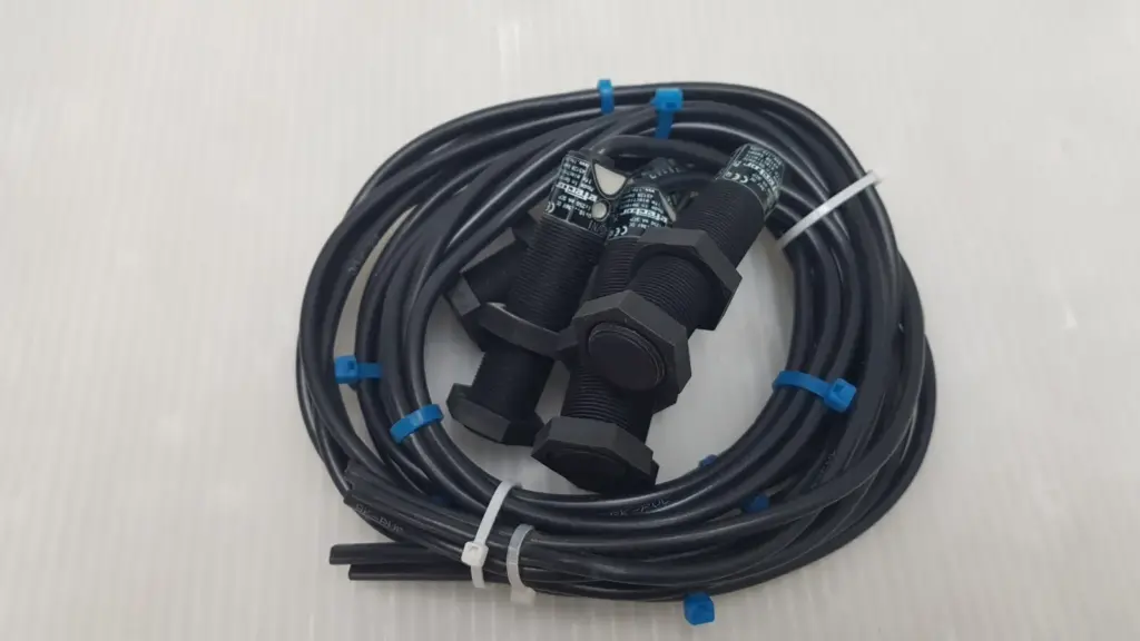 Five ifm efector KG5034 M18 capacitive sensors with black PVC cables bundled with cable ties