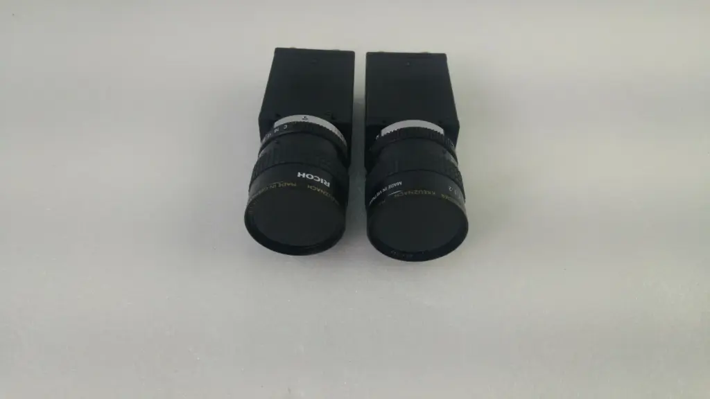 Two JAI CV-A50 CCD cameras side by side, each with a Ricoh Schneider-Kreuznach TV lens fitted