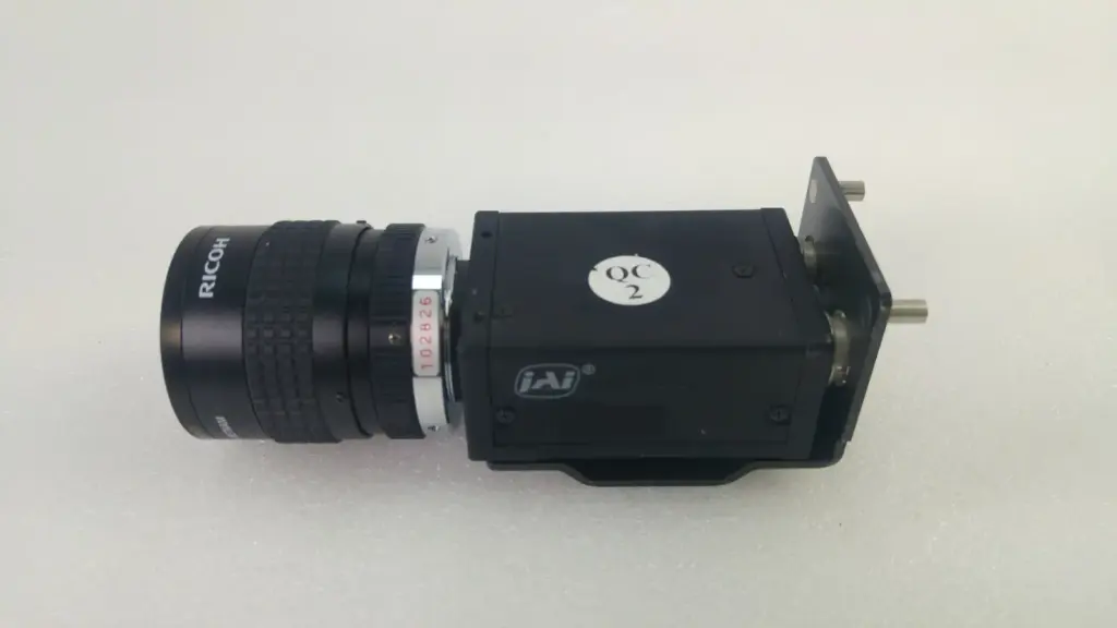 JAI CV-A50 monochrome CCD camera with Ricoh TV lens and mounting bracket, side view