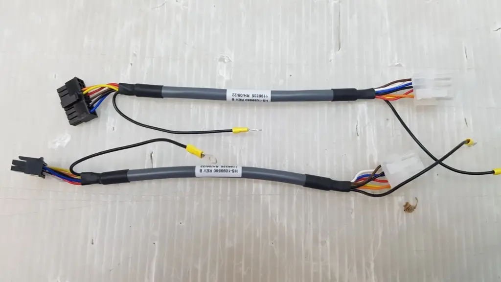 Two Lumenis HS-1099560 Rev B LVPS distribution board input harnesses with black and white connectors