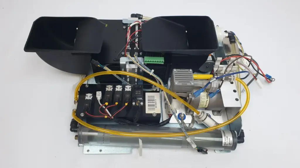 MUST electro mechanical assembly SA-10035050, top view: fan shrouds, valve block, pumps, reservoir and tubing