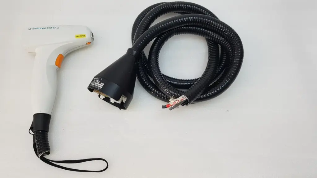 Lumenis Q-Switched Nd:YAG handpiece SA3751000 and its cut black umbilical cable with console connector