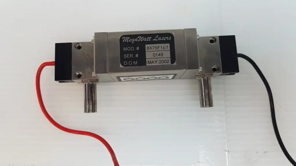 MegaWatt Lasers 8X75F1E1 pump chamber with label, side coolant ports, red and black leads