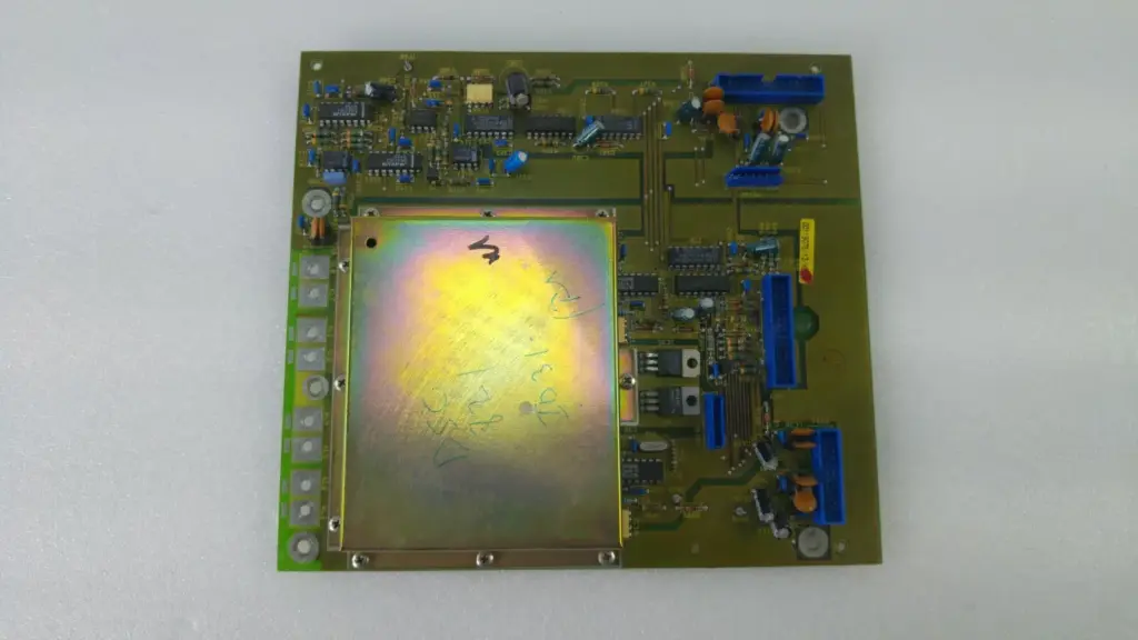 Mettler Toledo circuit board ME-119075c with metal shield and blue ribbon headers, hand-marked DSC 821