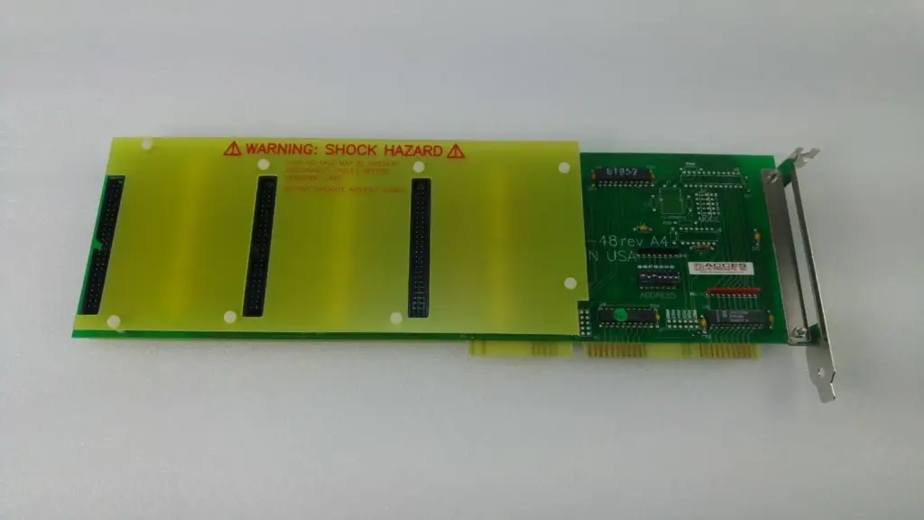 ACCES IDI-48A digital input card, Novellus 27-166887, with yellow shock hazard cover and three headers