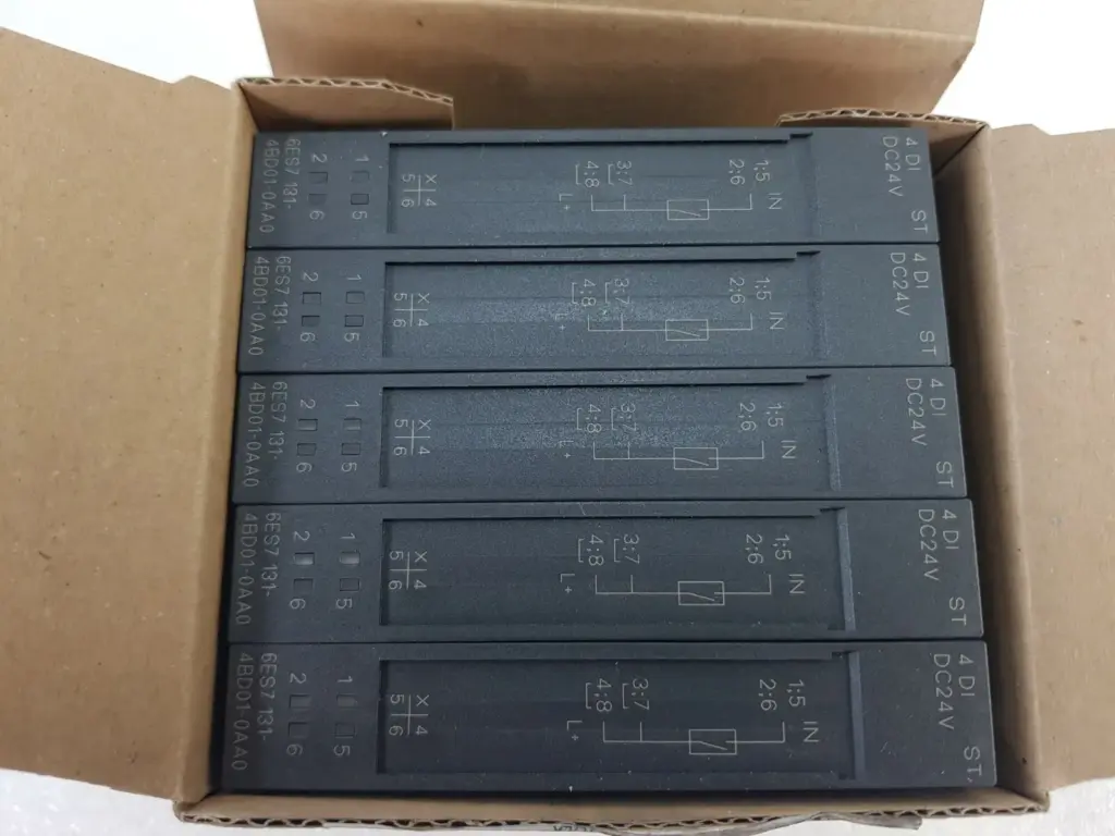 Open box with five Siemens 6ES7131-4BD01-0AA0 ET 200S 4DI DC24V ST modules