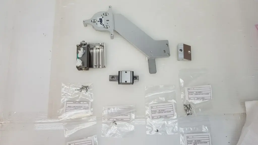 TEL CT5085-428149-13 modify set laid out: arm assy, air cylinder assy, guide block, angled block and screw bags