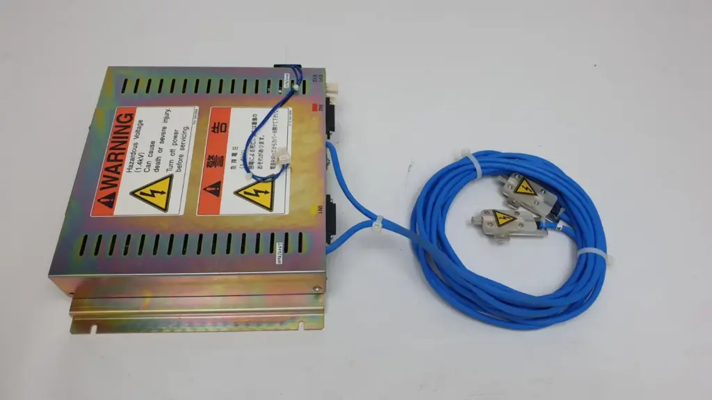 TREK high voltage control assembly with 1.4kV warning labels and two blue output cables