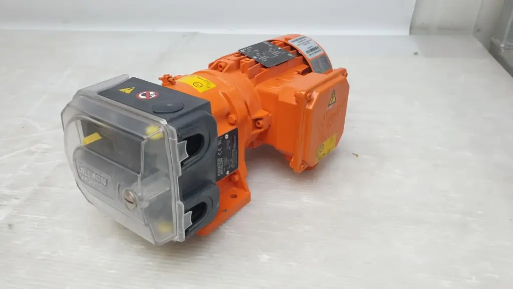Watson-Marlow 521I/RC close coupled peristaltic pump with clear pumphead guard and orange NORD motor